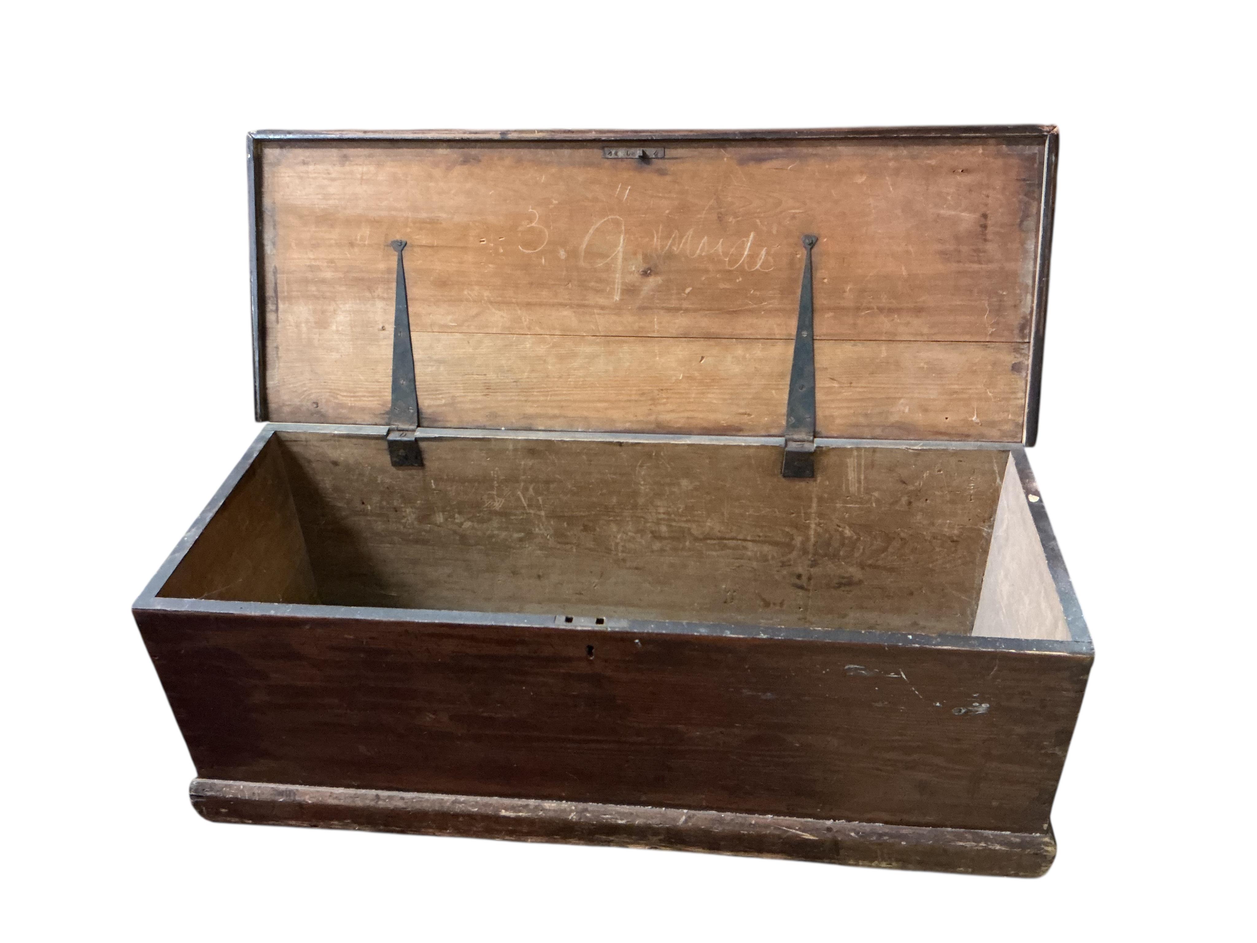 A 19th century rectangular pine trunk, width 124cm, depth 46cm, height 45cm